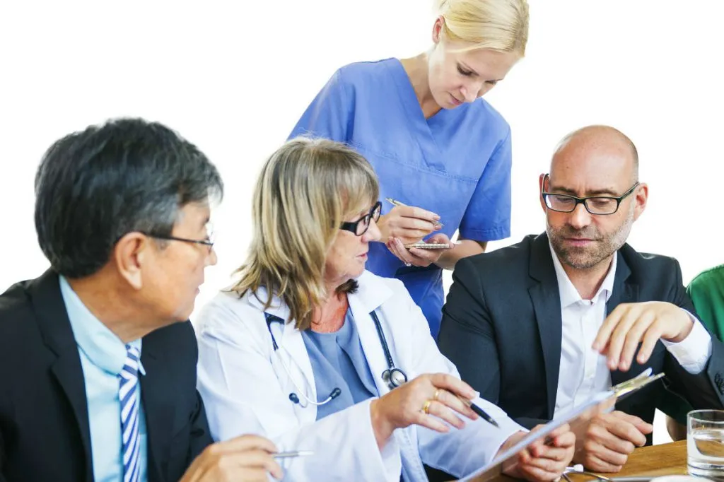 Healthcare workers and SAFERsleep software managers having a meeting.